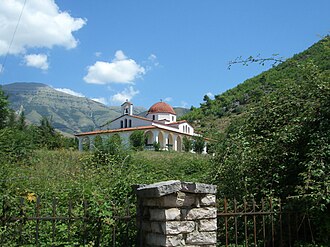 Modern apartment buildings and houses in Delvinë showcasing beautiful real estate properties